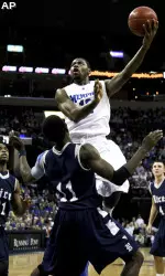Tyreke Evans drives to the basket over Rice forward Suleiman Braimoh in the first half.