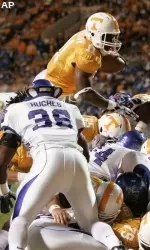 Tennessee's Bryce Brown (11) attempts to dive over the Memphis defensive line for a touchdown in the first half on Saturday.