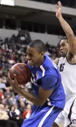 Memphis' Elliot Williams, left, gets a rebound in front of Arkansas-Little Rock's Lionel Foster, right, during the first half of an NCAA college basketball game in North Little Rock, Ark., Saturday, Dec. 12, 2009. (AP Photo/Danny Johnston)