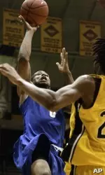 Antonio Anderson drives for a layup against Southern Mississippi center Gustavo Lino in the first half . (AP Photo/Steve Coleman)
