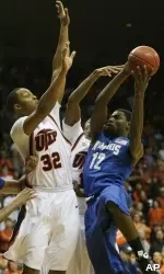 Tyreke Evans shoots over UTEP's Claude Britgten during the first half. (AP Photo/Victor Calzada)