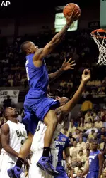 Antonio Anderson puts in a lay-up over UAB's Howard Crawford. (AP Photo/Butch Dill)