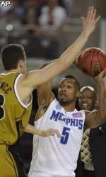 Memphis' Antonio Anderson (5) looks to pass the ball as Missouri's Matt Lawrence, left, defends during the first half of a men's NCAA college basketball tournament regional semifinal. (AP Photo/Mark J. Terrill)