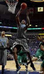 Robert Dozier shoots against Tulane during the first half. (AP Photo/Nikki Boertman)