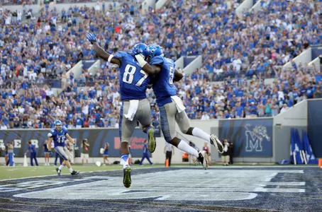 Mose Frazier celebrates the game's first touchdown.