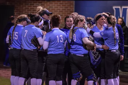 Player huddle, 2016 softball