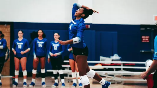 Courtney serving during game