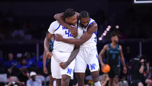 Dain Dainja and Moussa Cisse celebrating vs Tulane in AAC Championship semifinals
