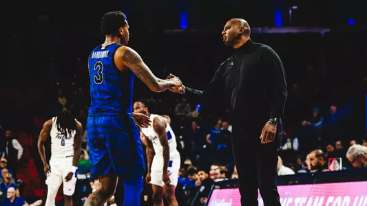 Ashton Hardaway and Penny Hardaway shaking hands