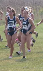 Becky Clark and Kelly Sraj each turned in a personal-best time in leading the Xavier women to a second place finish.