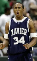 Stanley Burrell reacts after hitting a 3-point shot late in the second half. (AP Photo/Chuck Burton)