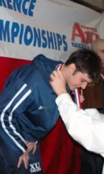 XU freshman Sam Gray is presented with his gold medal after winning the 1650 free event on the final day of the A-10 Championships.