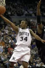 Stanley Burrell knocked down five of XU's 15 three-pointers to set a new school record on the evening.
