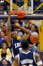 Xavier forward Derrick Brown dunks the ball in the first half.