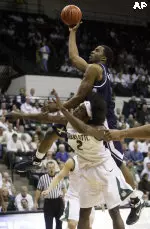 Xavier's Jamel McLean, top, shoots over Charlotte's Charlie Coley (2) during the first half of Thursday's game.