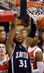 Jason Love (31) dunks against Duquesne