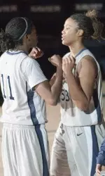 Amber Harris, left, and Ta'Shia Phillips, right, each posted a double-double against SJU.