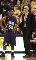 Head coach Chris Mack with Terrell Holloway