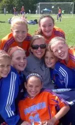 Keri Heedum (pictured with local youth soccer players) earned Ohio Youth Soccer's Competitive Girls Coach of the Year.