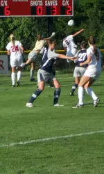 Sophomore goalkeeper Katie Markesbery punches out a ball against Miami