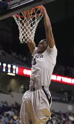 Travis Taylor scored 18 points and plucked 11 boards in Xavier's road-game against Charlotte.