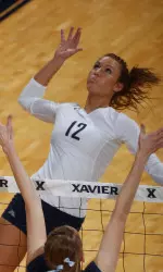 Alex Smith climbed to the top of Xavier's record books for career hitting percentage with a 10-kill effort against No. 7 Michigan.