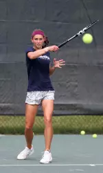Alex Brinker aids the team to victory with her singles match win.