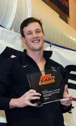 Chad Thompson with the 2014 Most Outstanding Swimmer Award.