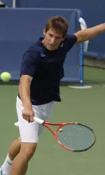 Senior Jimmy Roebker swings aways before rainfall.