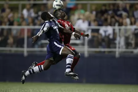 Eric McWoods fights for possession against St. John's.