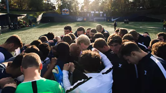 Men's soccer huddle