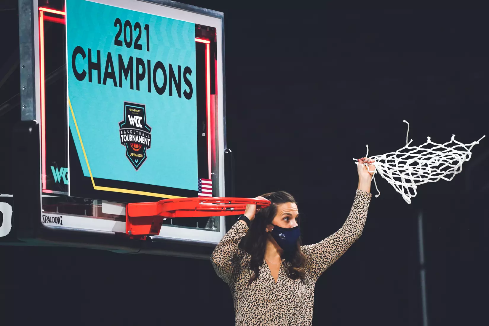 Mar 9, 2021; Las Vegas, NV, USA; Gonzaga Bulldogs head coach Lisa Fortier poses with the net after the West Coast Conference Tournament championship against the BYU Cougars at Orleans Arena. Gonzaga defeated BYU 43-42. Mandatory Credit: Kirby Lee-USA TODAY Sports