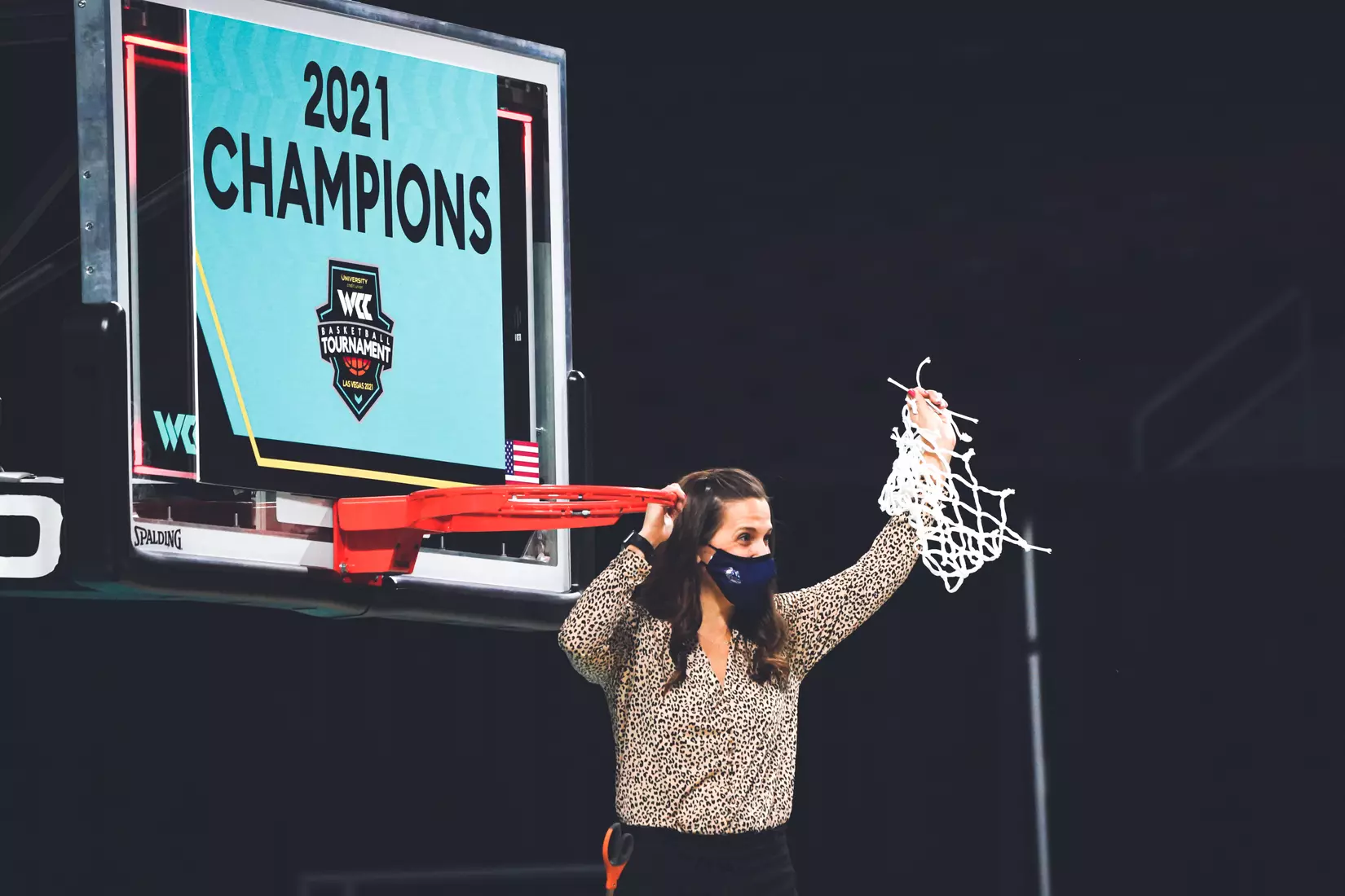 Mar 9, 2021; Las Vegas, NV, USA; Gonzaga Bulldogs head coach Lisa Fortier poses with the net after the West Coast Conference Tournament championship against the BYU Cougars at Orleans Arena. Gonzaga defeated BYU 43-42. Mandatory Credit: Kirby Lee-USA TODAY Sports
