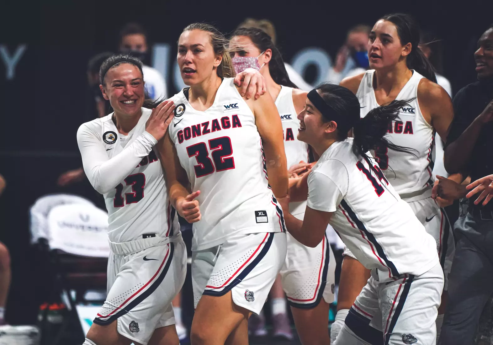 Mar 9, 2021; Las Vegas, NV, USA; Gonzaga Bulldogs guard Jill Townsend (32) celebrates with guards Cierra Walker (13) and Kaylynne Truong (14) after scoring the game-winning basket as time expired in the West Coast Conference Tournament championship against the BYU Cougars at Orleans Arena. Mandatory Credit: Kirby Lee-USA TODAY Sports