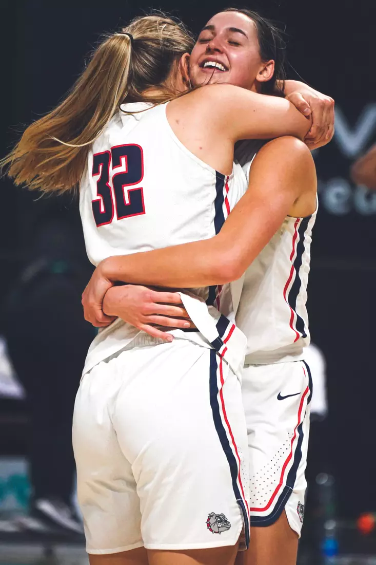 Mar 9, 2021; Las Vegas, NV, USA; Gonzaga Bulldogs guard Jill Townsend (32) celebrates with guard Abby O'Connor (R) after scoring the game-winning basket as time expired in the West Coast Conference Tournament championship against the BYU Cougars at Orleans Arena. Mandatory Credit: Kirby Lee-USA TODAY Sports