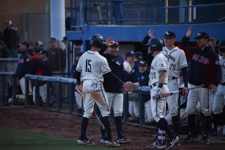 Ernie Yake congratulated by teammates
