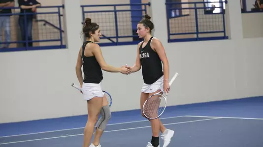 Sophie Whittle and Graciela Rosas high-five