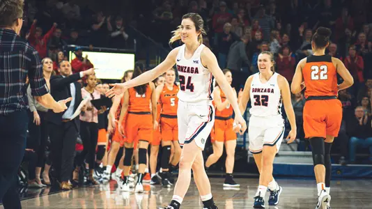 Katie Campbell high-fives teammate