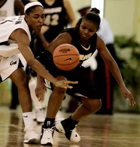 Whitney Allen, left, bats the ball away from Purdue guard Shakira Webb during the second half.