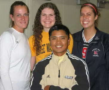 Head coach Jojit Coronel with his three new towering recruits, Katie Butz, Madelyn Bagby and Abby Syverson.