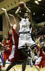 Omar Williams goes up for a jump shot over Saint Francis' Grant Surprenant, left, during the second half. (AP Photo/Haraz N. Ghanbari)