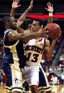 Carl Elliott, left, and Danilo Pinnock, behind pressure N.C. State's Cameron Bennerman (13) (AP Photo)