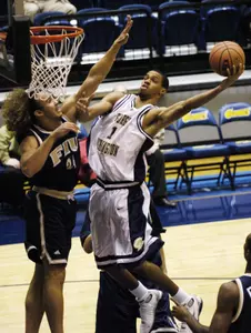 Omar Williams goes to the basket against FIU's Ivan Almonte during the first half.
