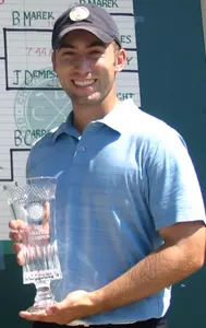 Brian Carroll accepts the trophy at the CDGA Amateur Championship as the top amateur in Chicago on June 30. Carroll's father served as his caddy.