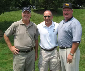 Former GW baseball player and tournament sponsor Bill Collins (R) and guest speaker Tim Cullen (L) pose with head coach Steve Mrowka.