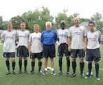 GW Coach George Lidster (center) with Shaun Gore (second from right), the director of football development for the Chelsea FC, and Chelsea's youth soccer coaching staff.