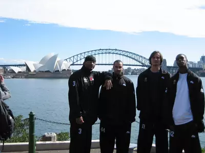 Mike Hall, Keri Gonsalves, Alex Kireev and Dokun Akingbade take in the sights in Australia Monday. Behind the foursome is the world-famous Sydney Opera House and the arcing Sydney Harbor Bridge.