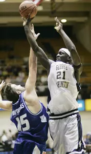 Pops Mensah-Bonsu shoots over Saint Louis' Ian Vouyoukas during the first half.