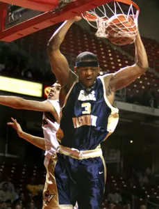 Mike Hall finishes off a dunk in front of Temple's Sergio Olmos in the first half. (AP Photo/Rusty Kennedy)