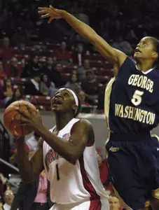 Maryland's Crystal Langhorne shoots as George Washington's Kimberly Beck tries to block during the second half of their basketball game Sunday, Nov. 19, 2006 in College Park, Md.Langhorne finished with 20 points in the 73-48 Maryland victory.(AP Photo/Gail Burton)